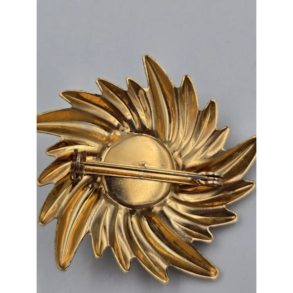 Vintage Gold Tone Swirl Sunburst Brooch Pin with Black Cabochon Center 1980s 90s